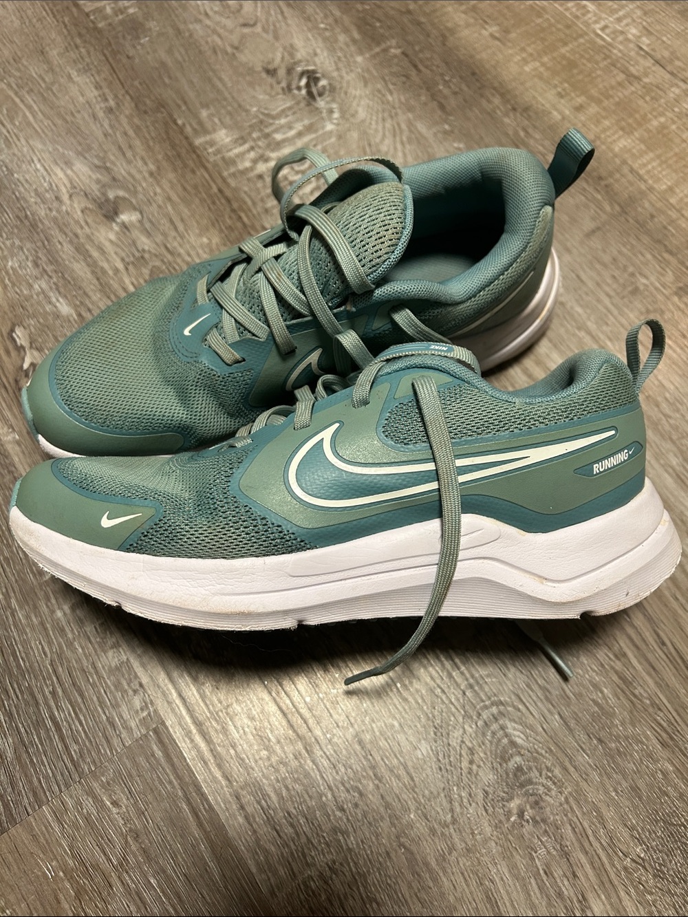Nike Teal Running Shoes with White Sole